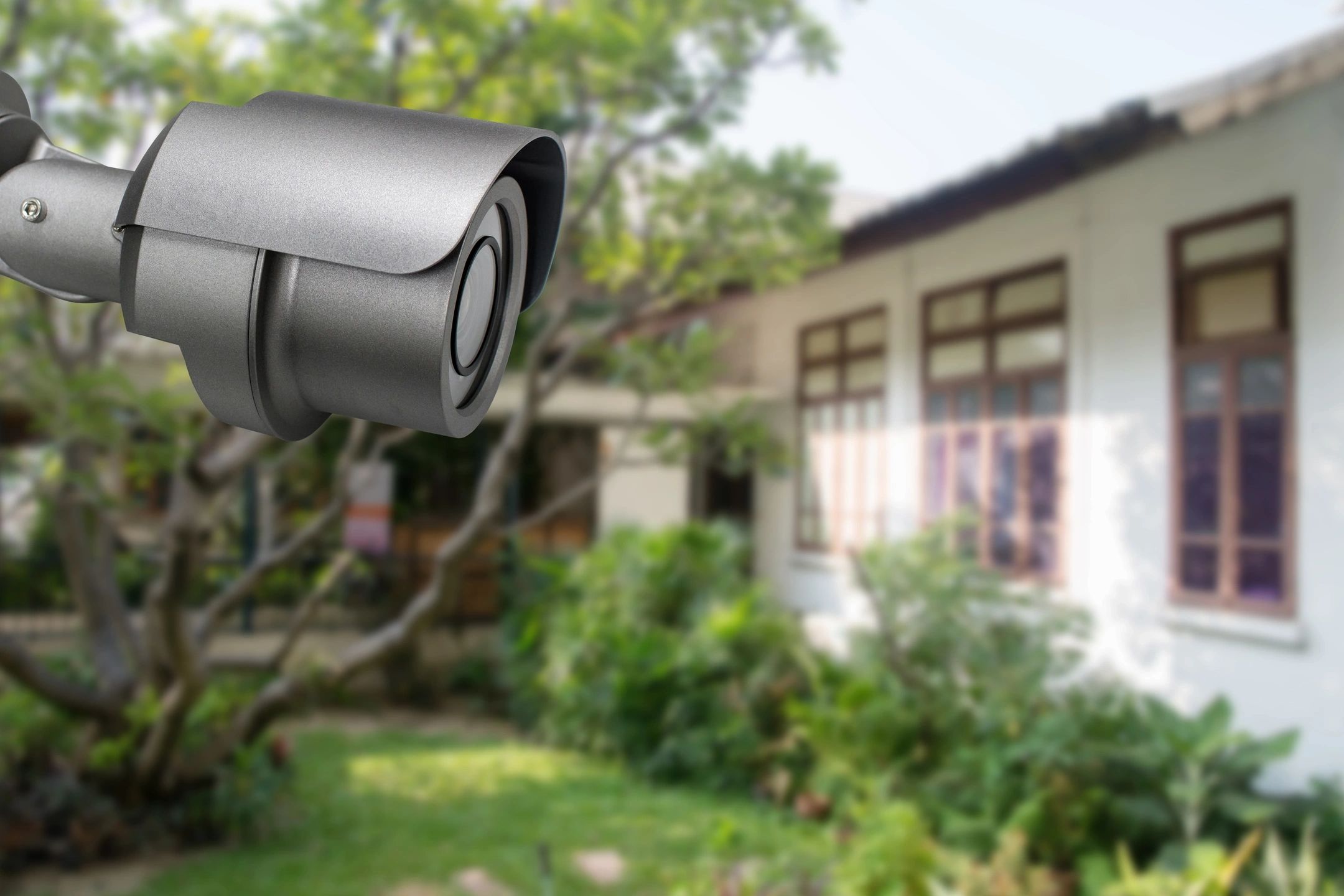 Security camera monitoring a residential property
